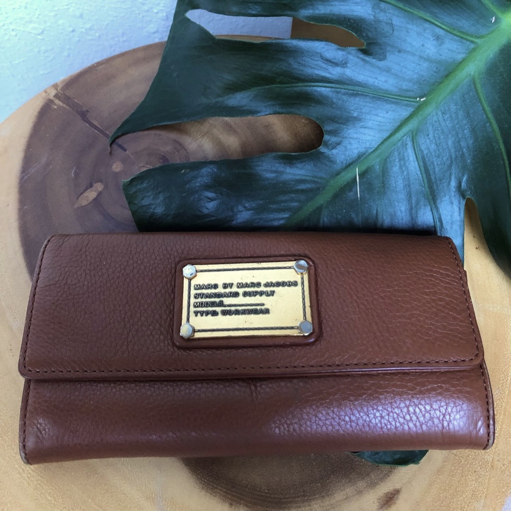 Gently used Marc Jacobs wallet, rich brown leather with gold hardware
